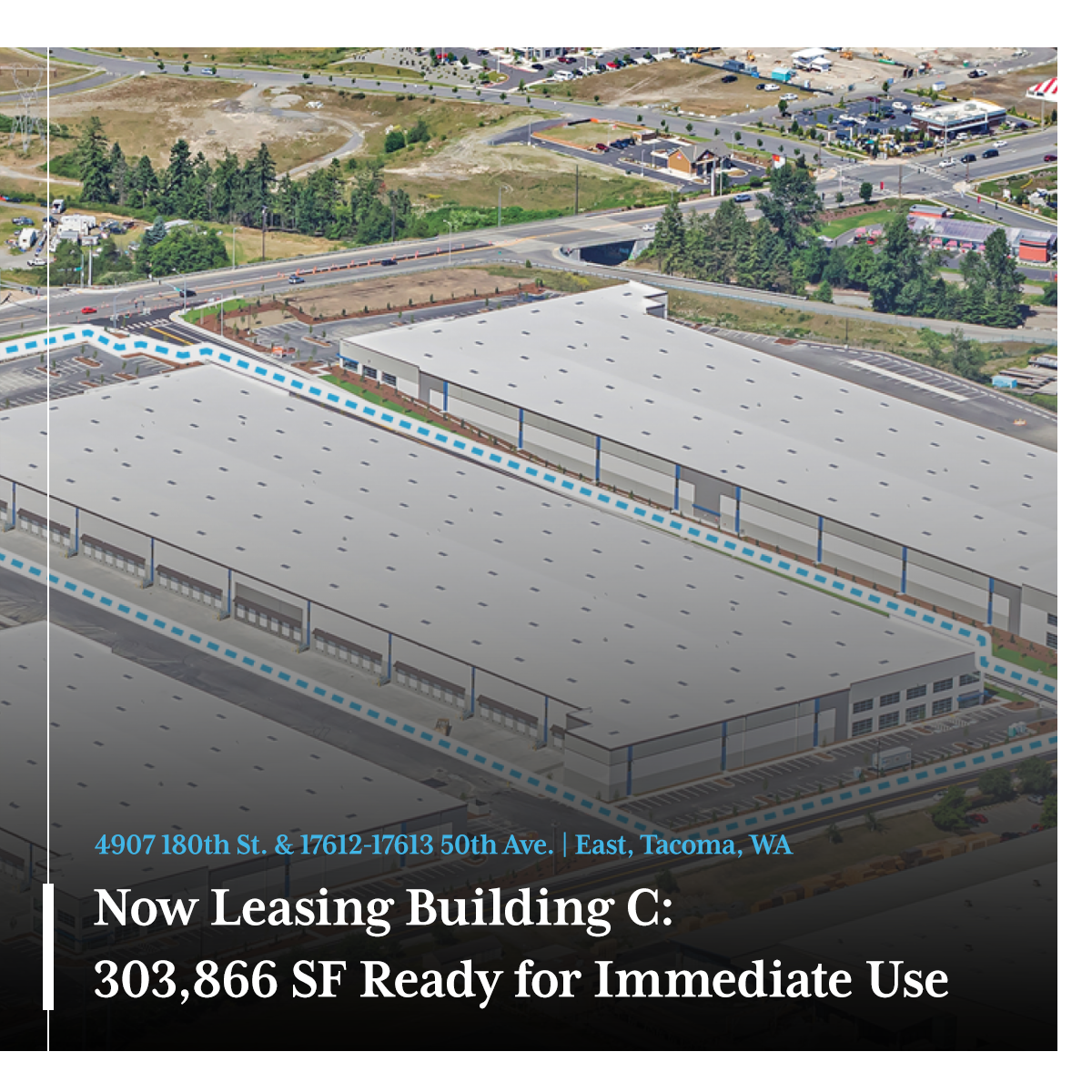 Exterior view of a modern commercial building with large windows, greenery, and address number displayed.