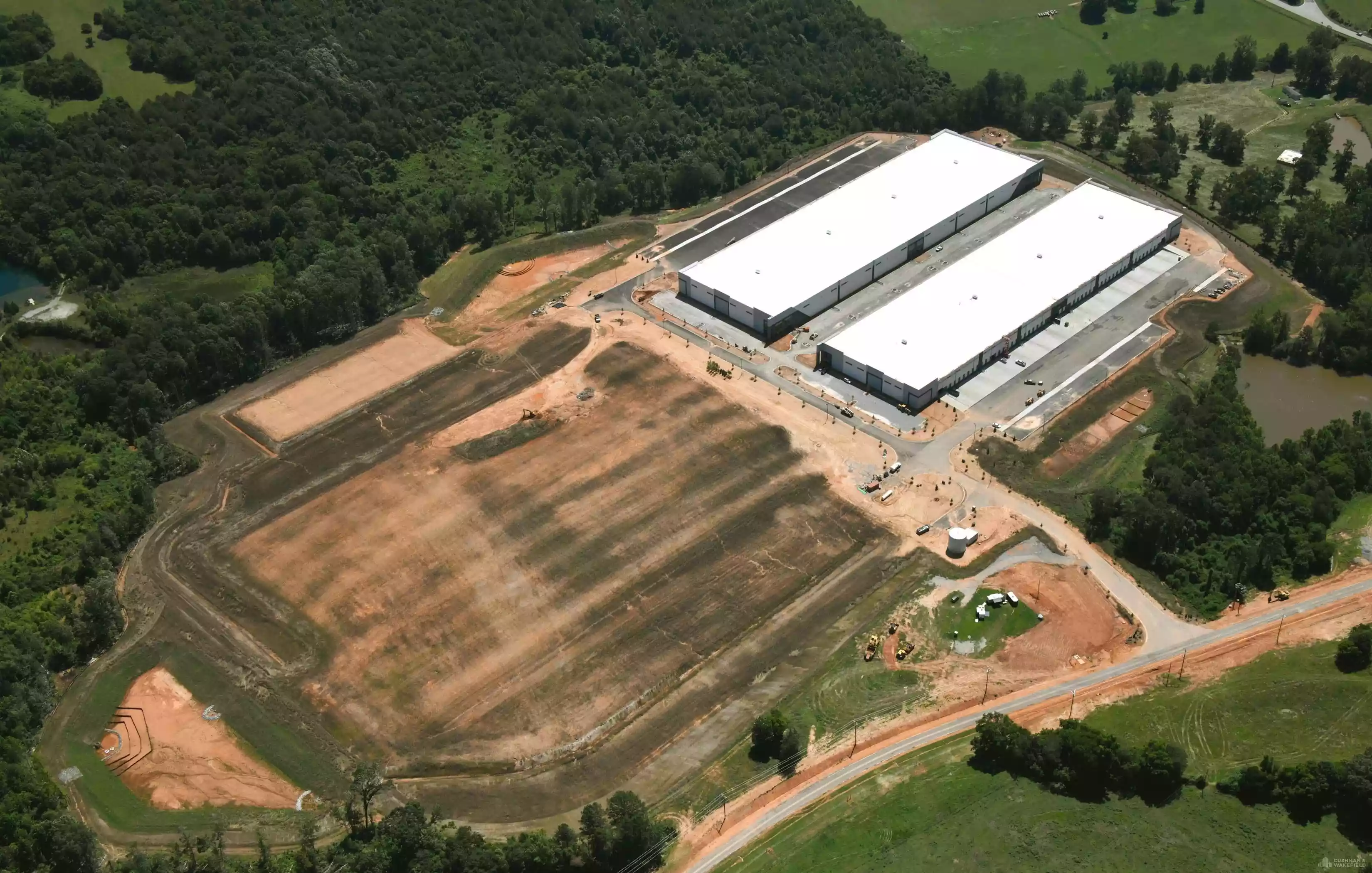 Aerial view showing building and surrounding land