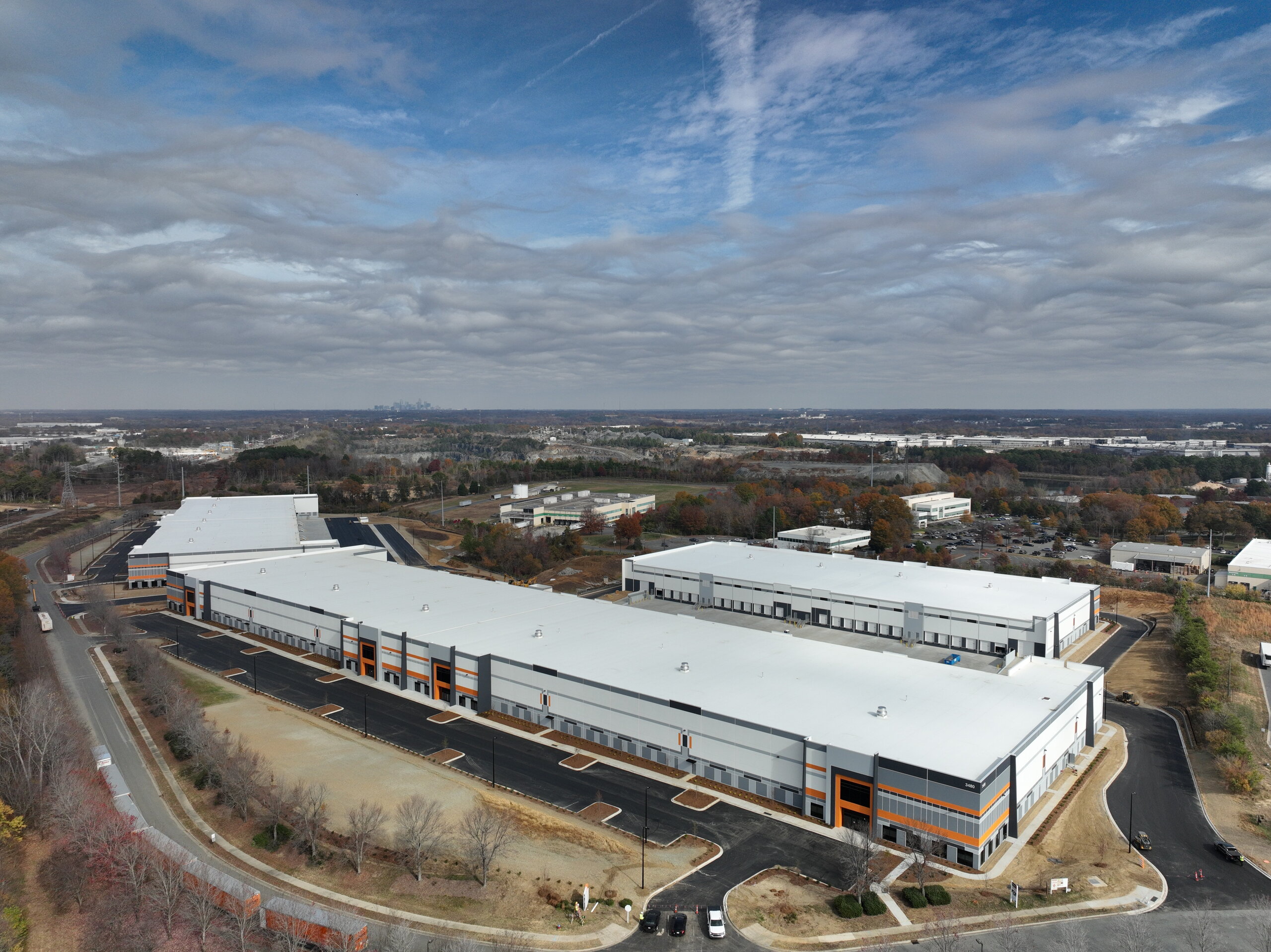 Aerial view of the property and surrounding site
