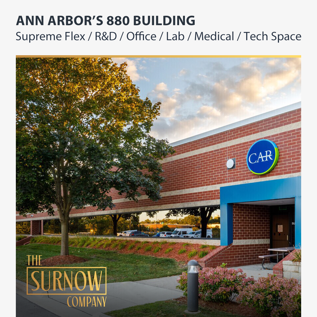 Exterior view of 880 Technology Drive with landscaping and parking