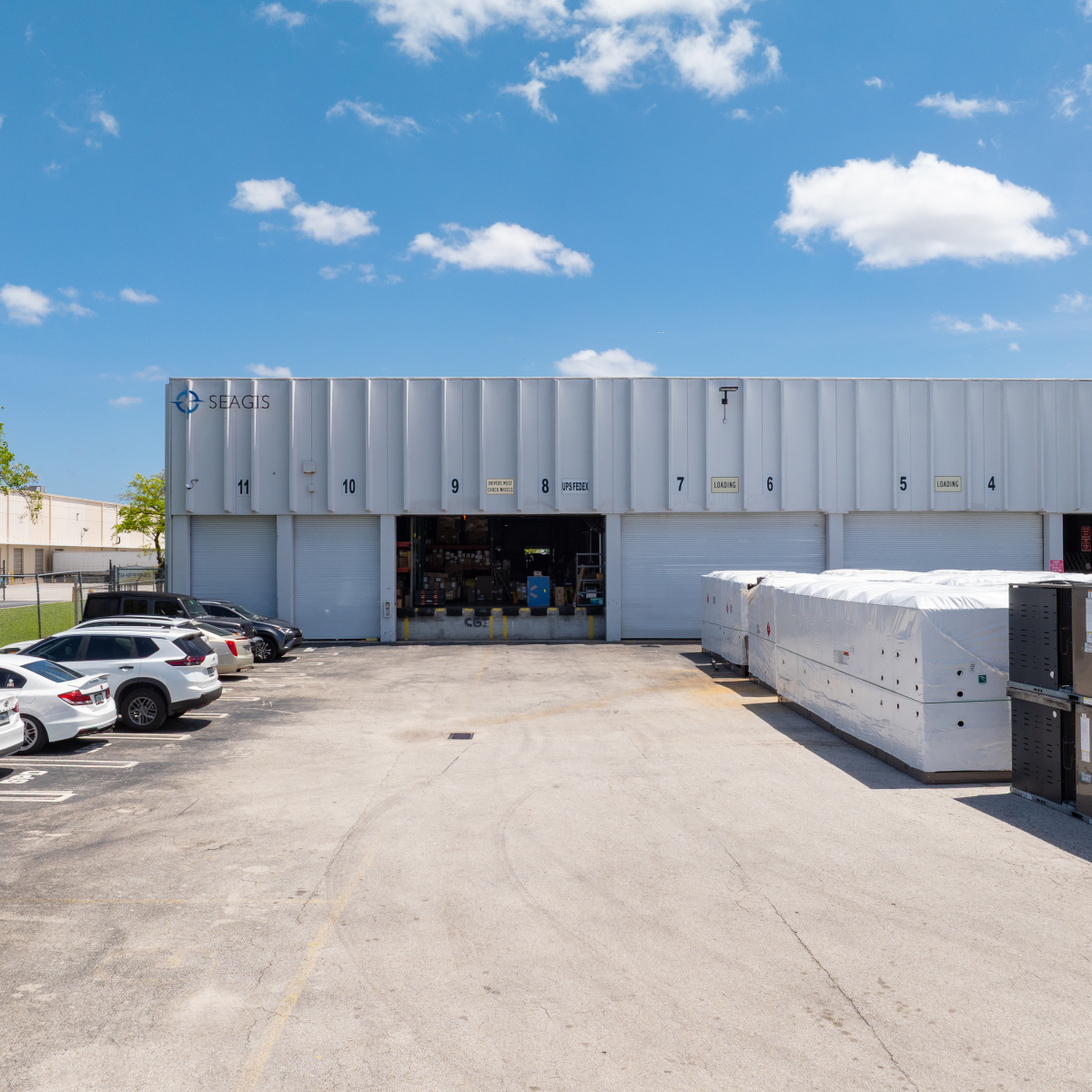 Exterior warehouse with loading docks and signage