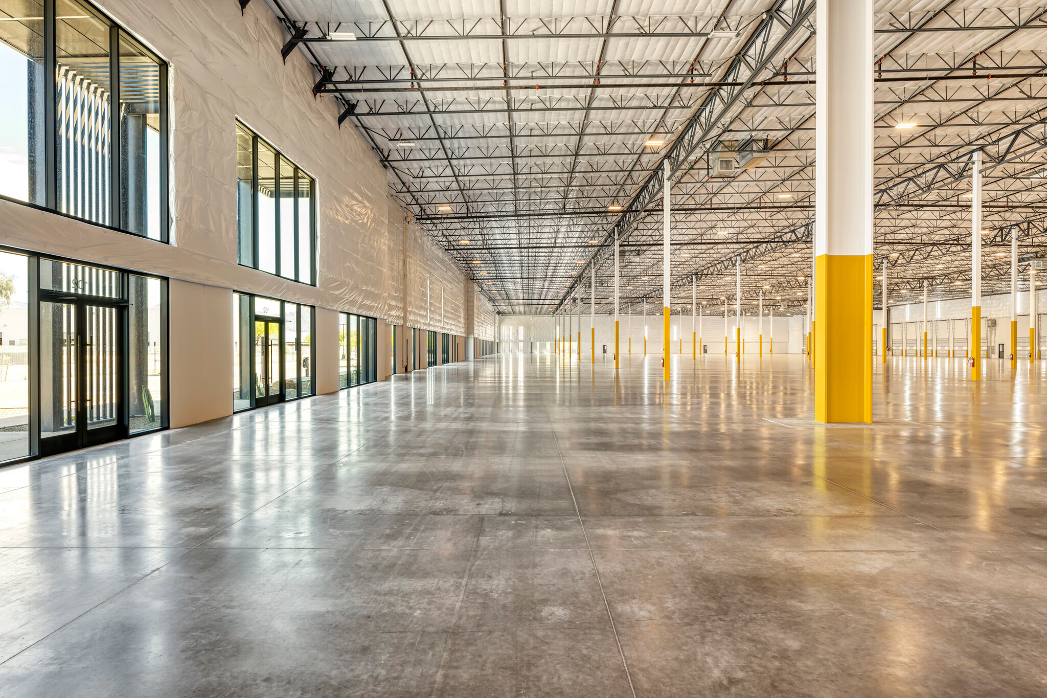 Warehouse interior with high ceilings and sealed concrete floor