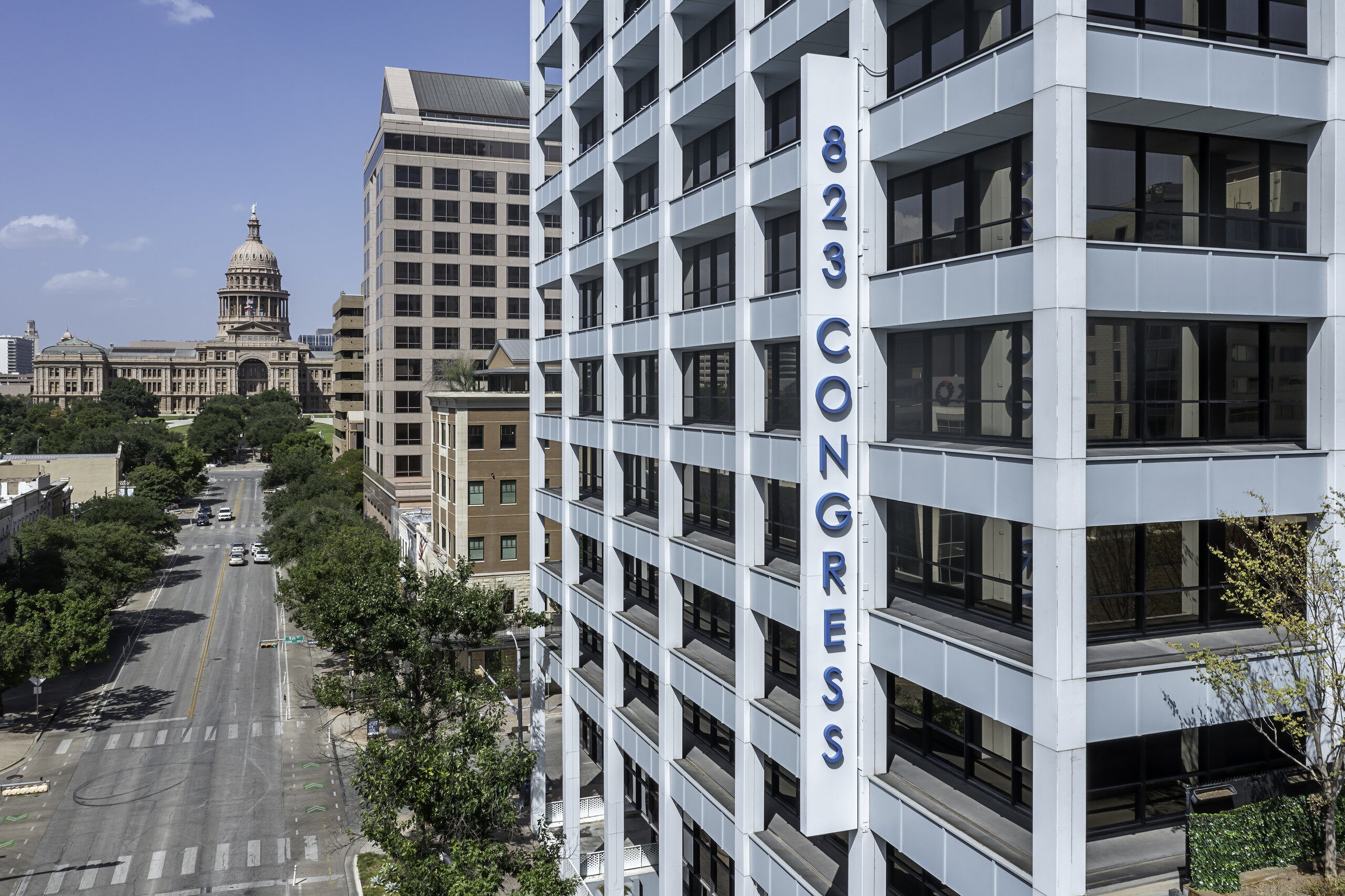 Exterior 823 Congress Ave entrance with capitol view