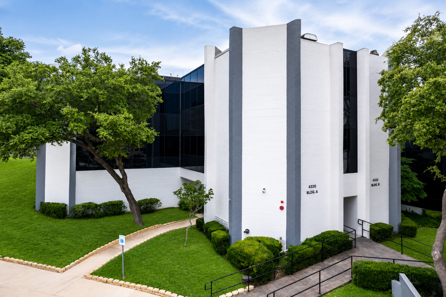 Modern commercial building exterior with landscaping