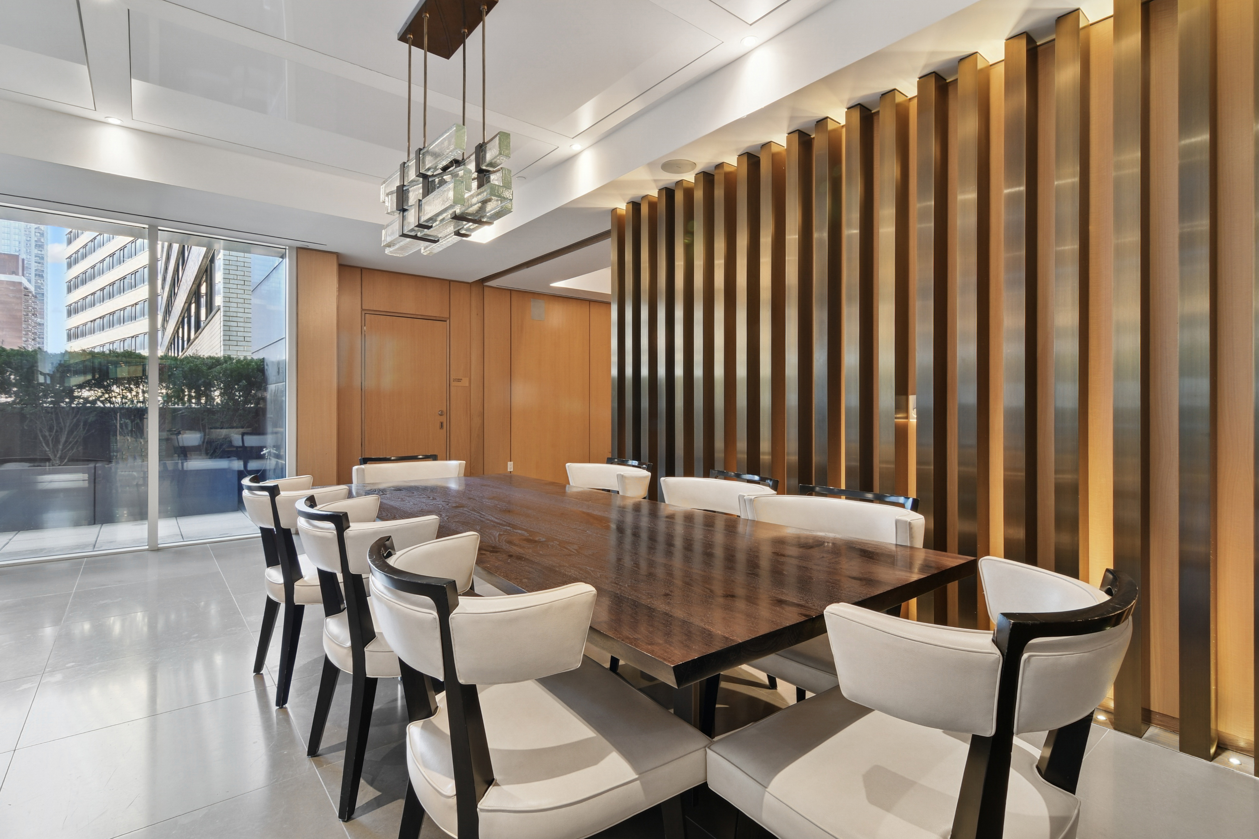 Warm wood conference room with terrace access