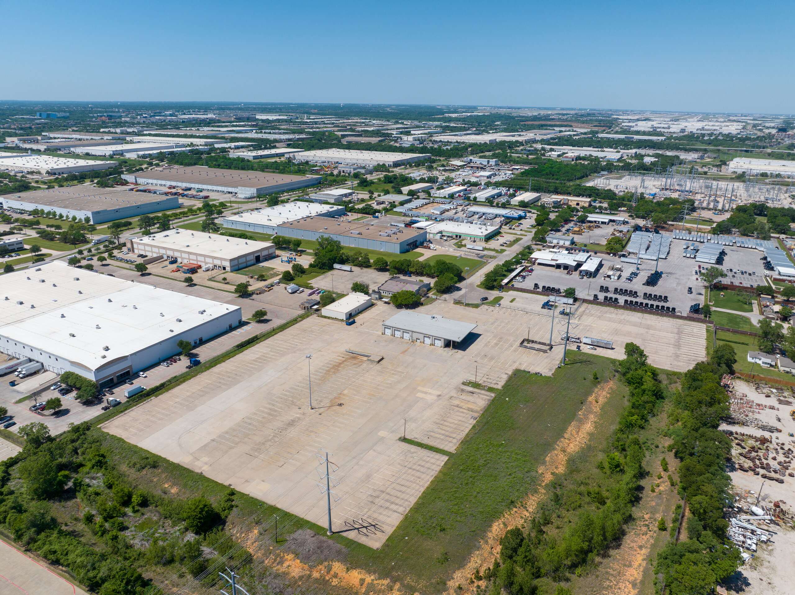 Parking and exterior view of 3375 High Prairie Rd industrial property