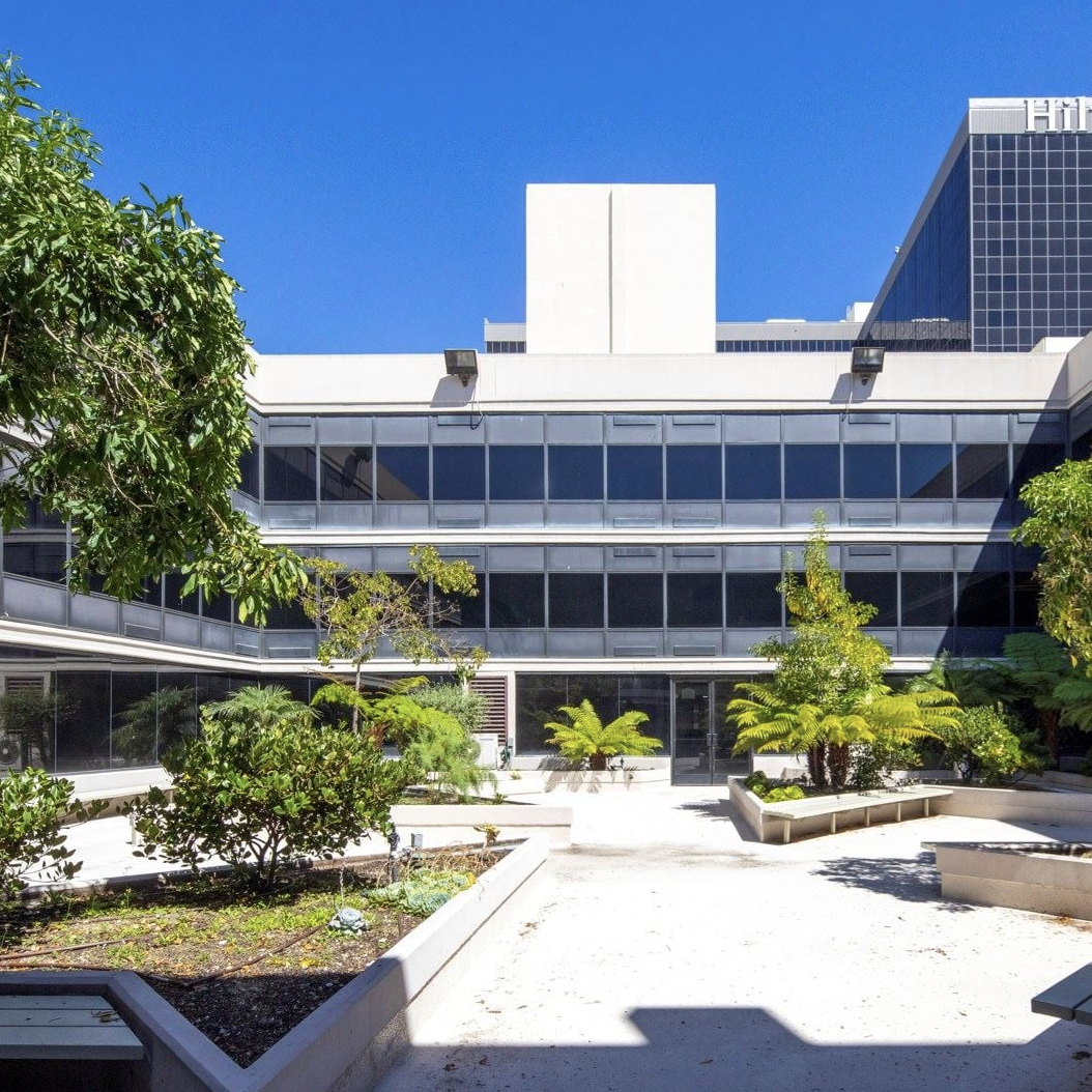 Exterior view showing modern architecture and landscaping