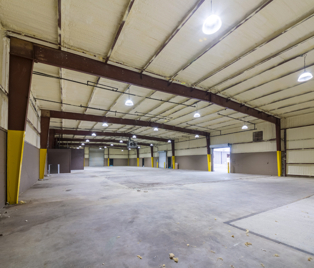 Industrial warehouse interior showing high ceilings and expansive space at 1931 Rock Chapel Rd