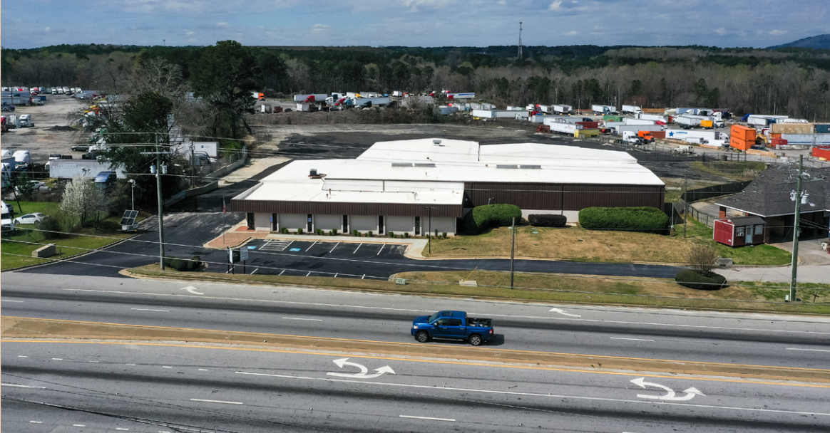 Aerial exterior view of 1931 Rock Chapel Rd with surrounding parking and landscaping