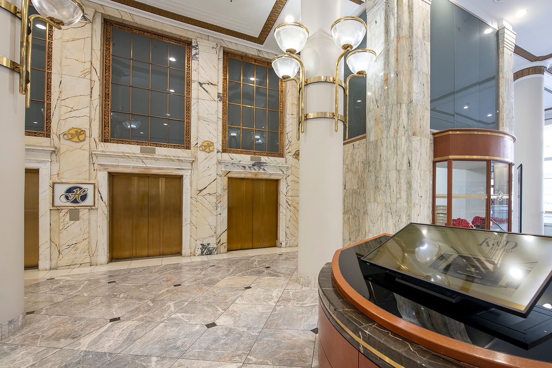 Restored marble and gold details in The Halle Building lobby