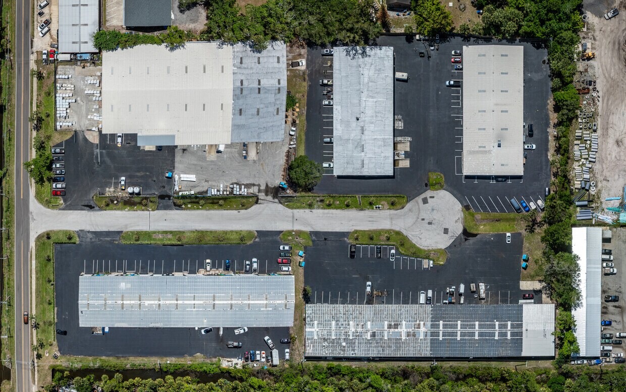 Industrial building exterior with ample parking