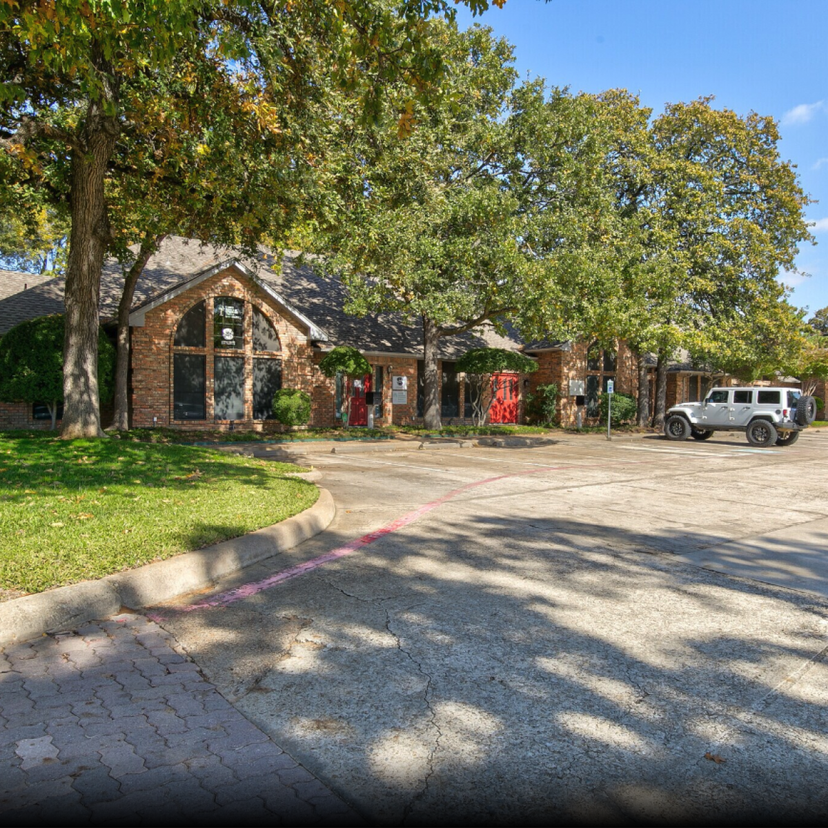 Tree-lined brick office suites at Park Central