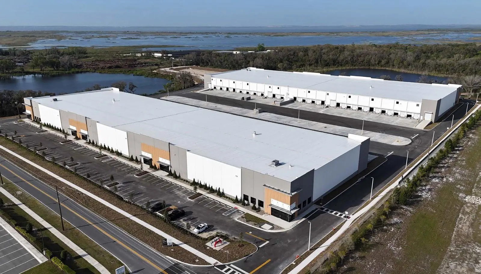 Aerial view of Apopka Business Center buildings and surrounding lakes